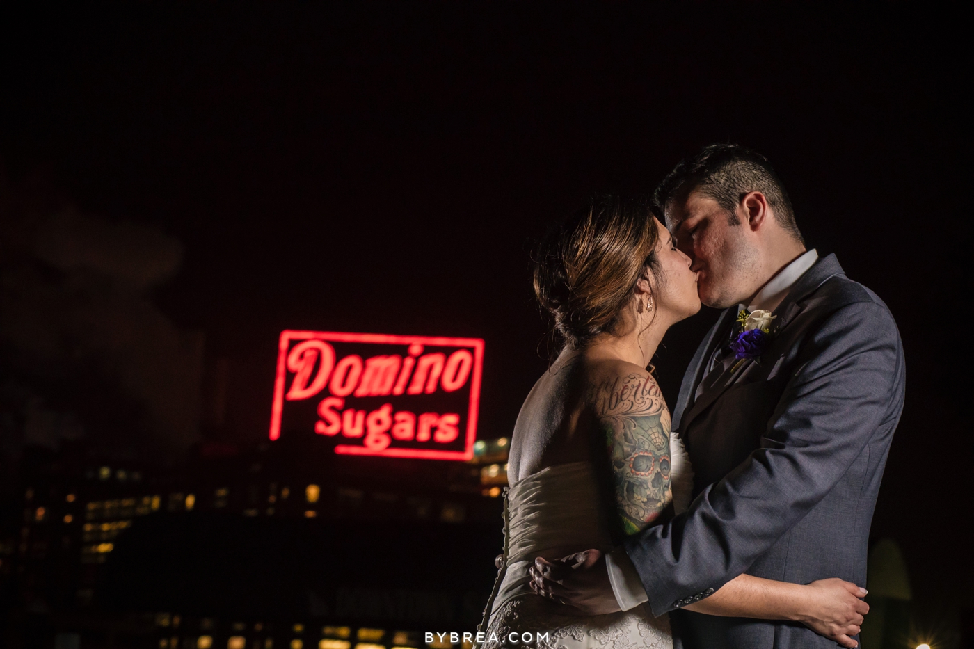 Baltimore wedding night photo bride and groom kissing