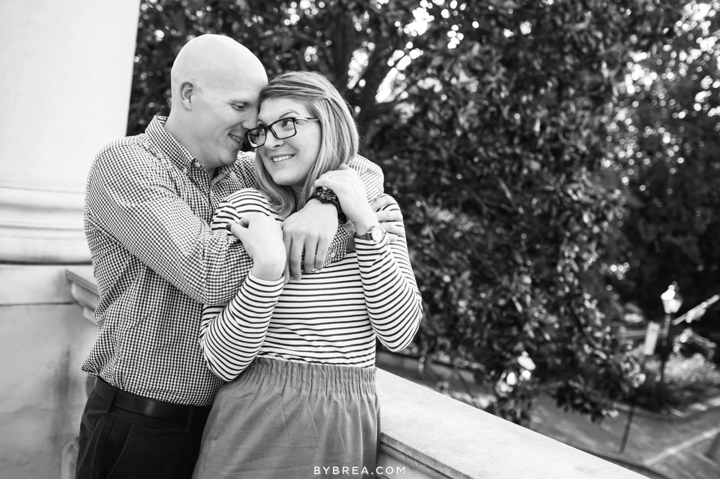 Annapolis engagement woman looking over shoulder at man