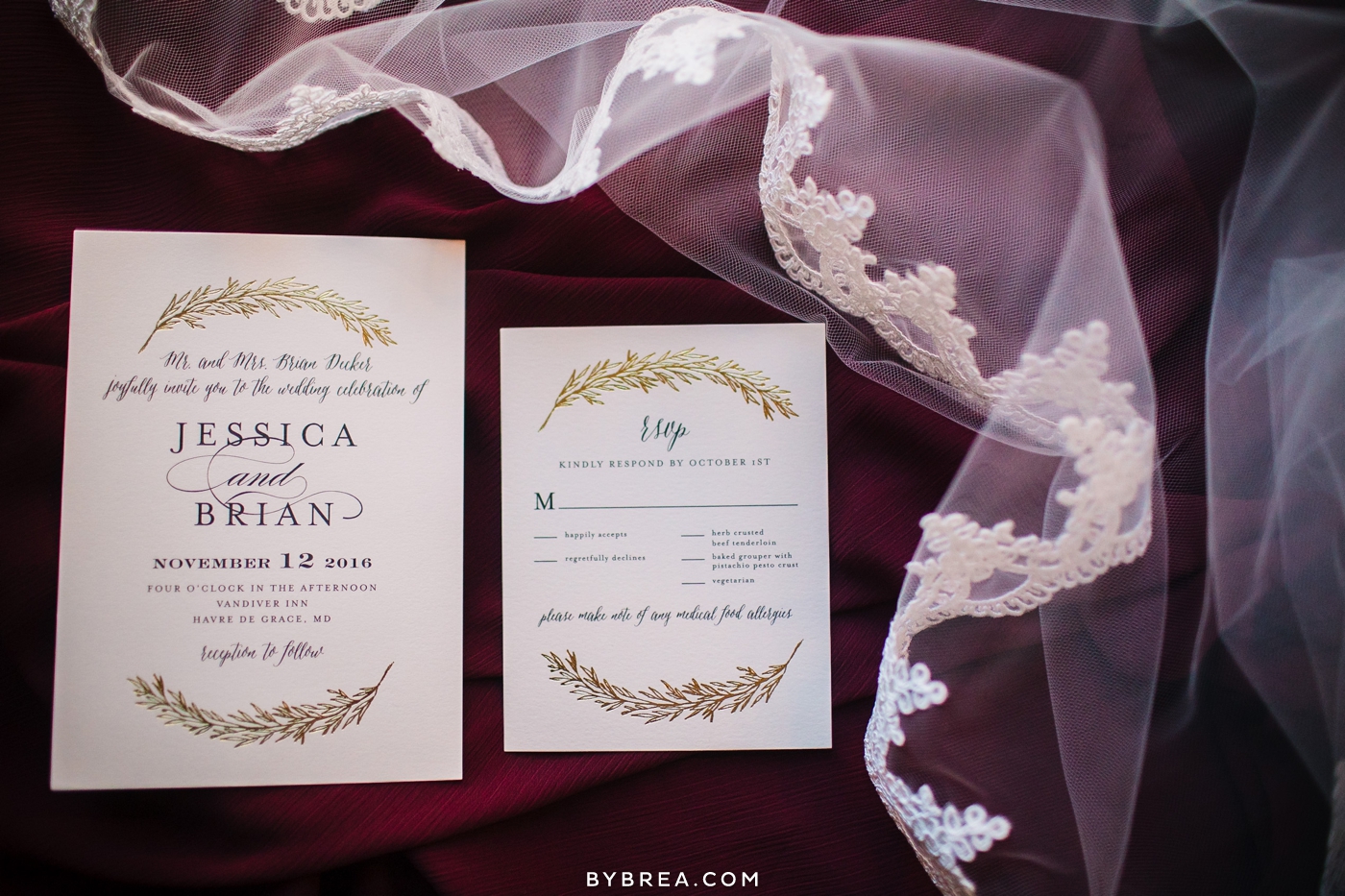 Vandiver Inn wedding invitations by Minted presented with veil