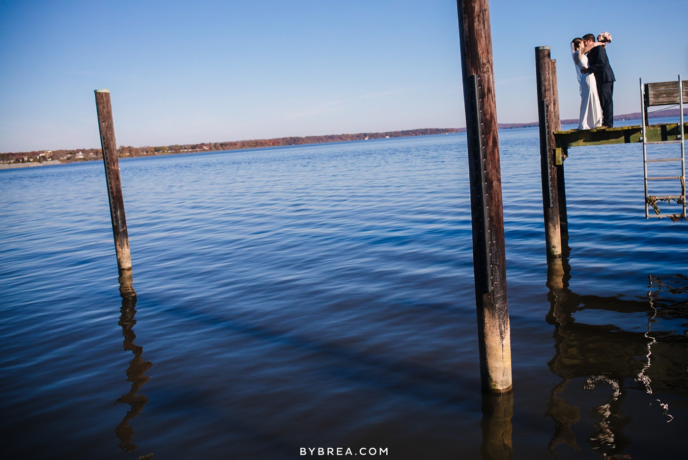 Vandiver Inn wedding bride and groom kissing on pier by the water