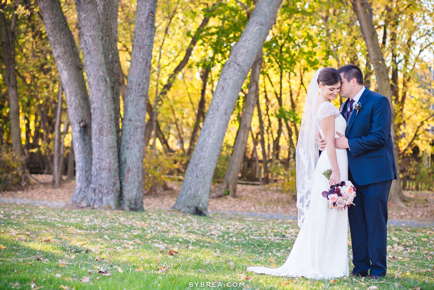 Vandiver Inn wedding groom kisses the bride's cheek outdoors