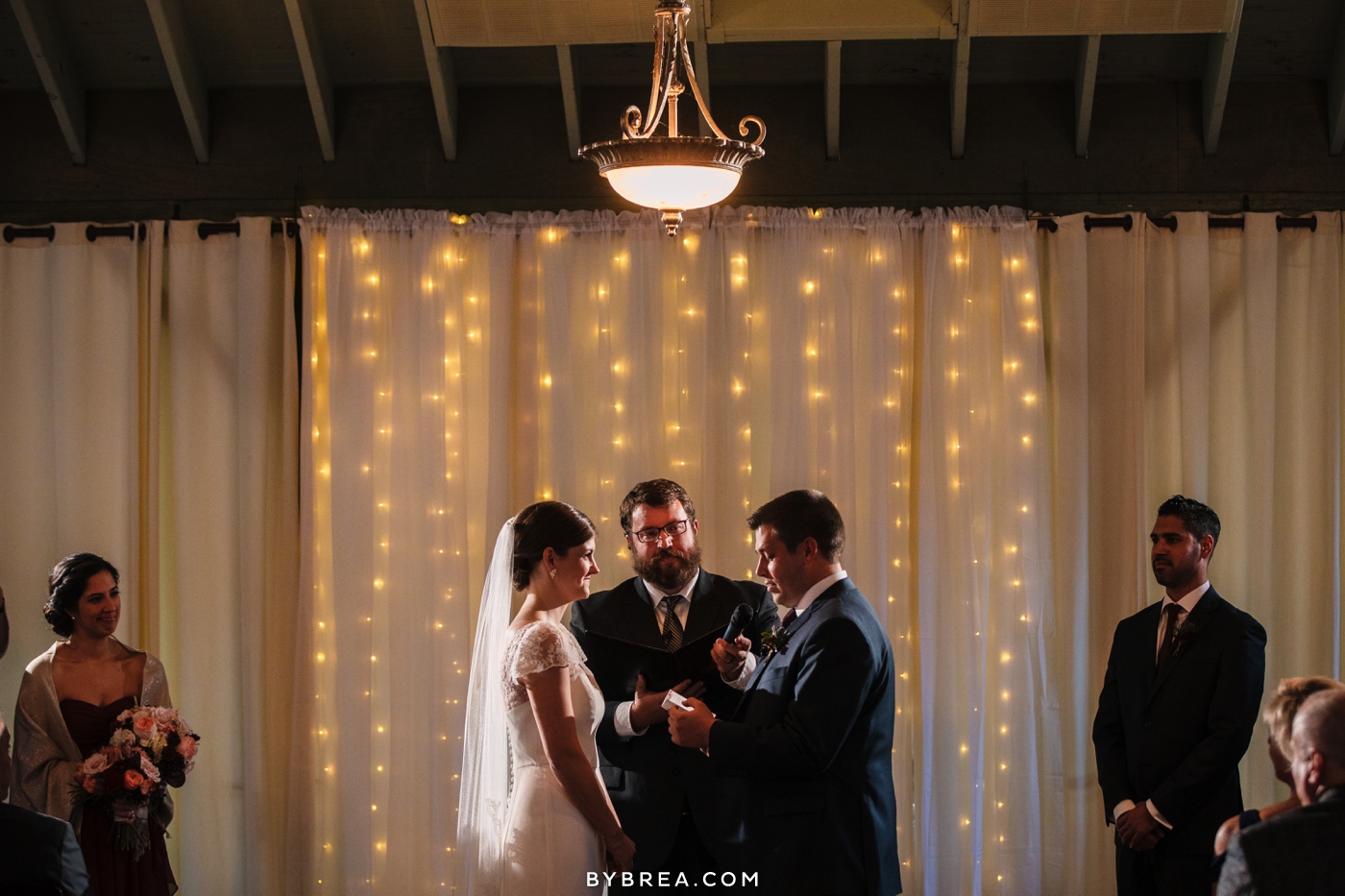 Vandiver Inn wedding groom reading vows to bride