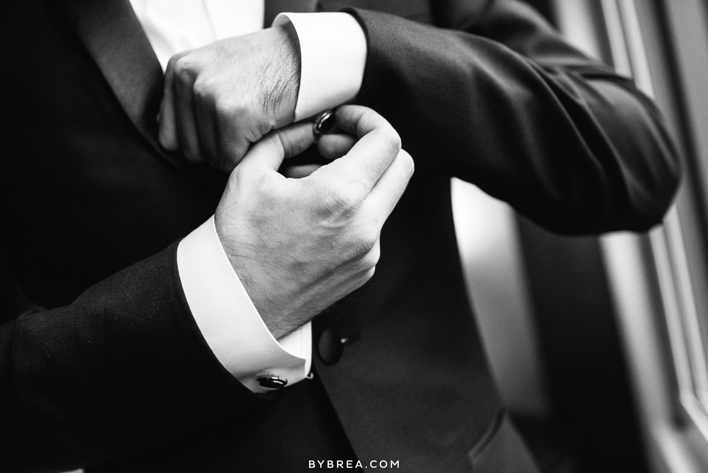 Hotel at Arundel Preserve wedding photo groom adjusts cufflinks