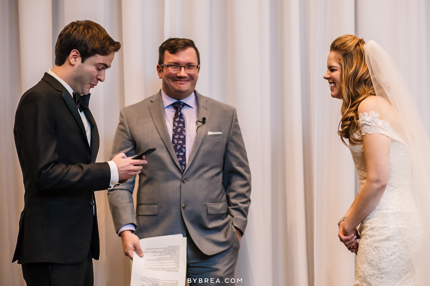 Hotel at Arundel Preserve wedding photo bride laughs during groom's vows