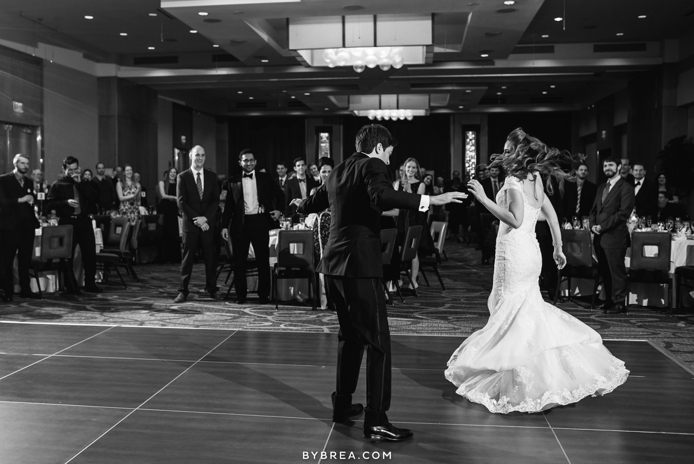 Hotel at Arundel Preserve wedding photo groom twirls bride first dance