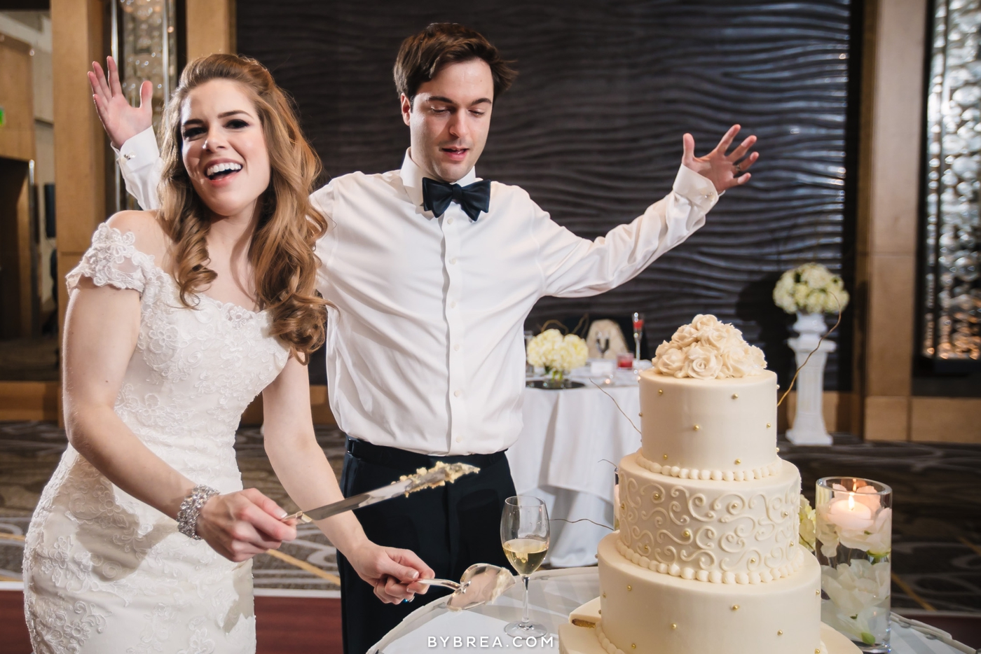 Hotel at Arundel Preserve wedding photo bride cuts cake and groom's like whattt