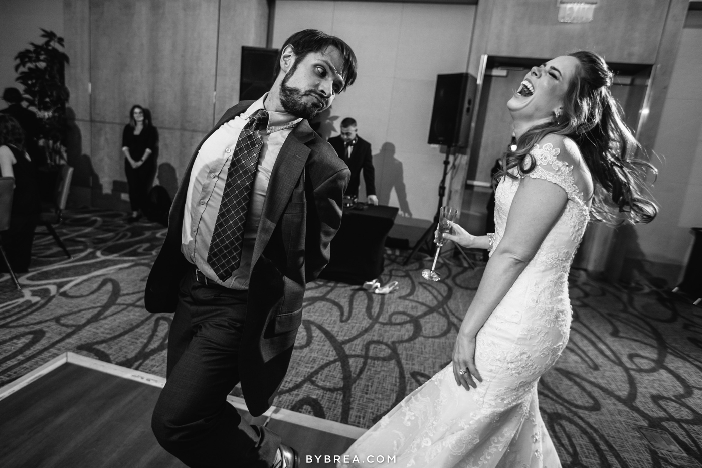 Hotel at Arundel Preserve wedding photo bride laughing as guest makes silly face