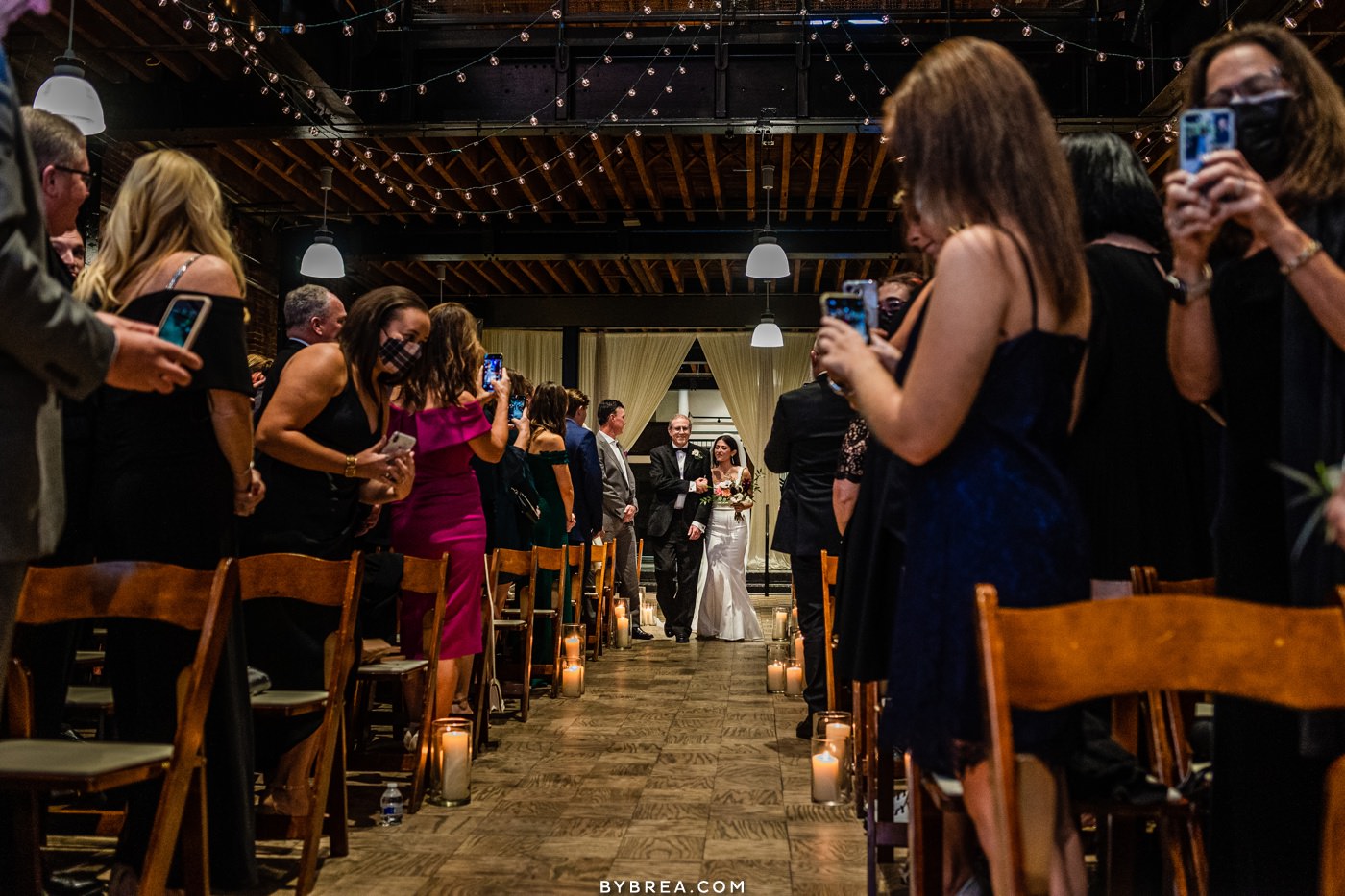 Bride walks down aisle at the assembly room in Baltimore