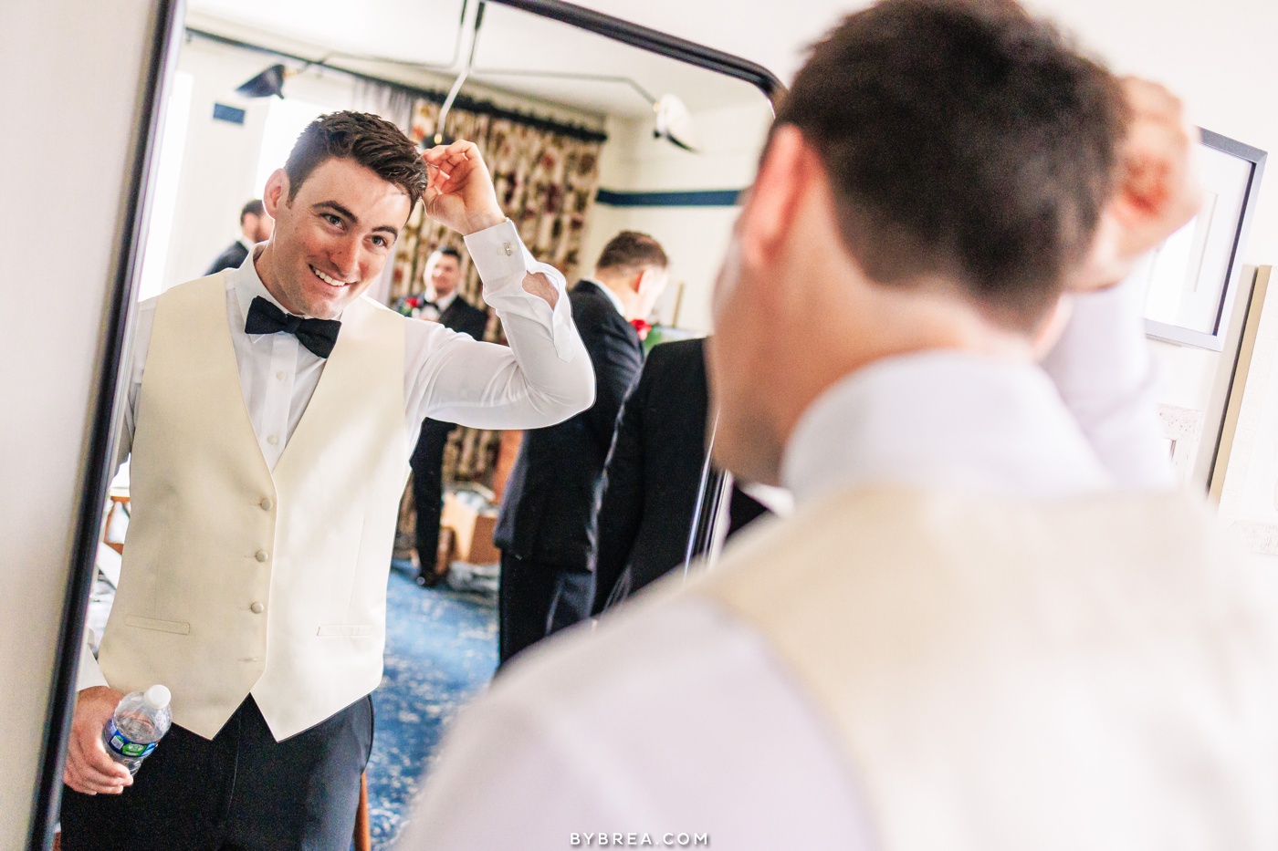 Hotel Revival Baltimore photo of groom getting ready for his wedding.