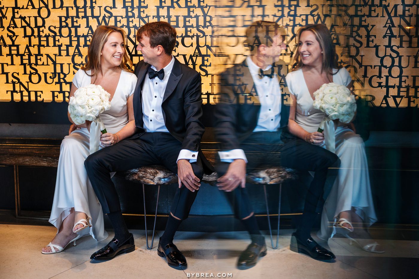 bride and groom near the front door of the sagamore pendry