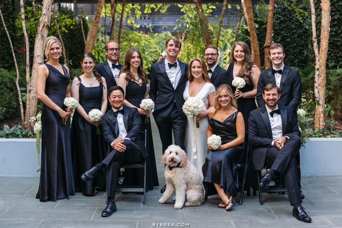 wedding party in the courtyard at the sagamore pendry
